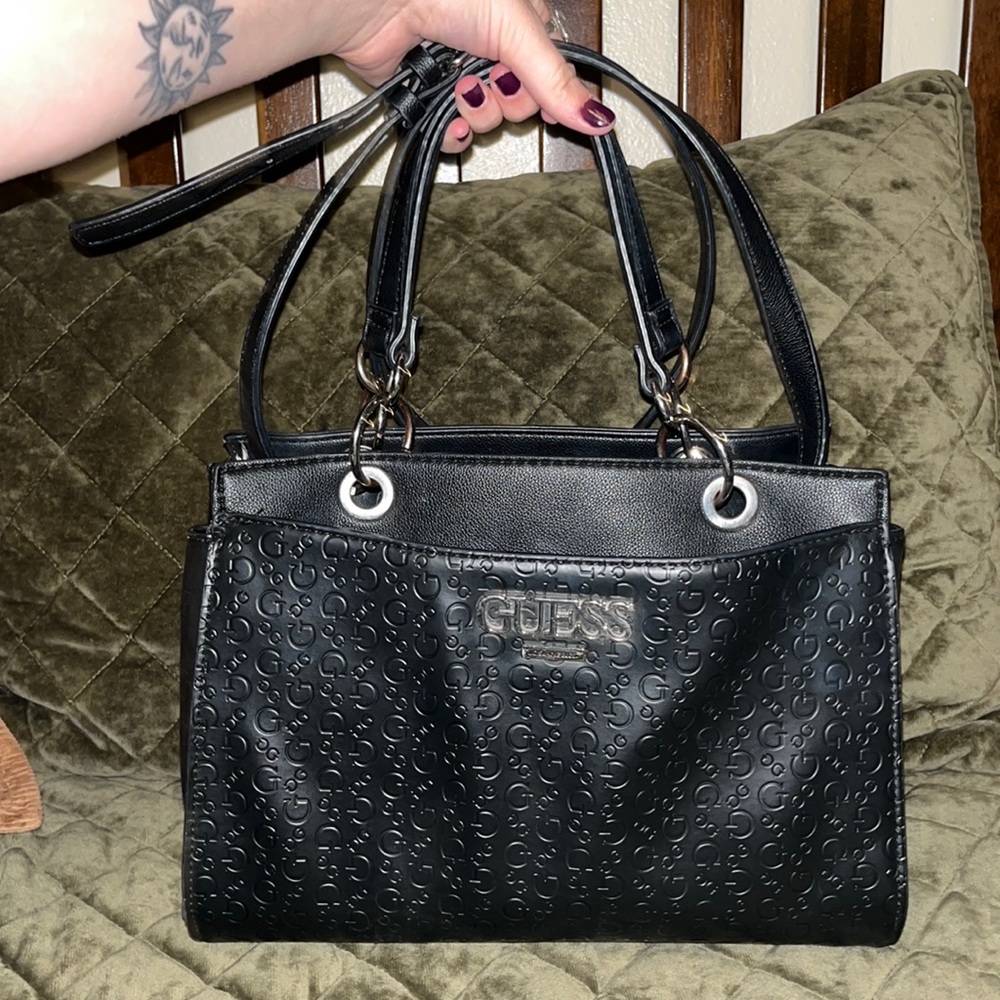 Black Guess Handbag, with strap. Used. still in great condition!